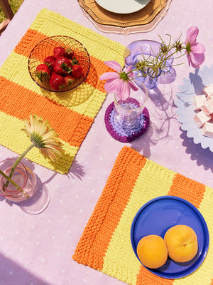 Photo of two Orange and Yellow Ollie Placemats and Coasters Knit kits