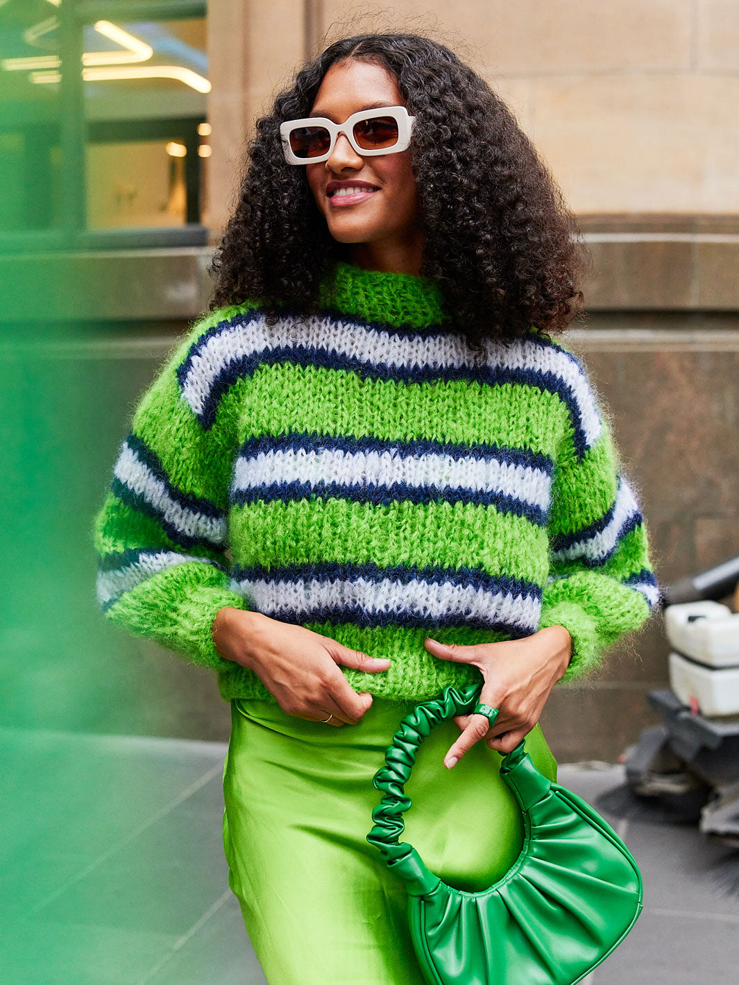 Girl wearing neon green stripey chunky mohair jumper by Cardigang